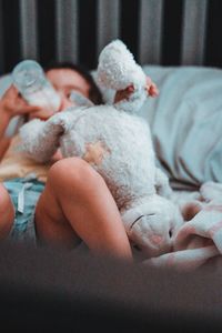 Close-up of baby sleeping on bed