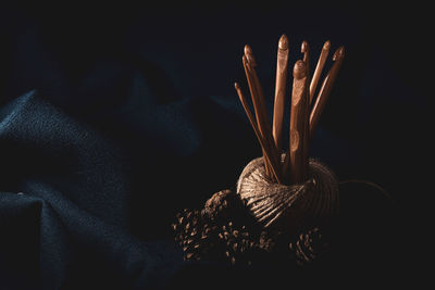 High angle view of jute rope with crochet hooks