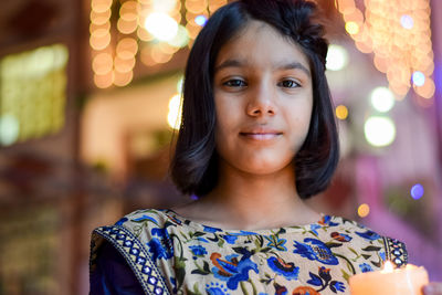 Portrait of girl against lens flare