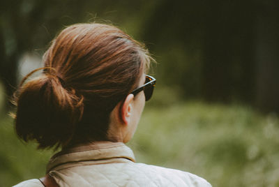 Rear view of woman with hair bun