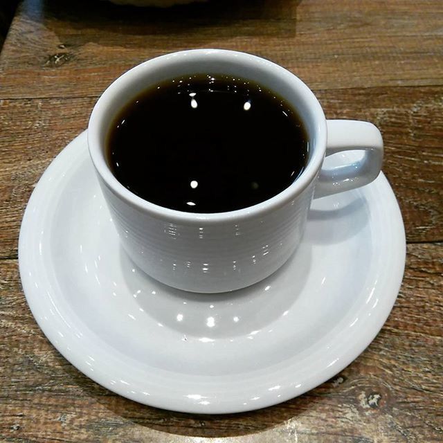 indoors, coffee cup, table, drink, food and drink, refreshment, coffee - drink, still life, saucer, freshness, directly above, high angle view, cup, coffee, wood - material, close-up, black coffee, tea cup, no people, overhead view