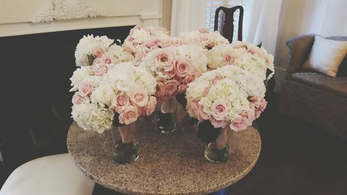 Close-up of rose bouquet on table at home