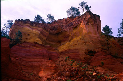 Low angle view of rock formation against sky