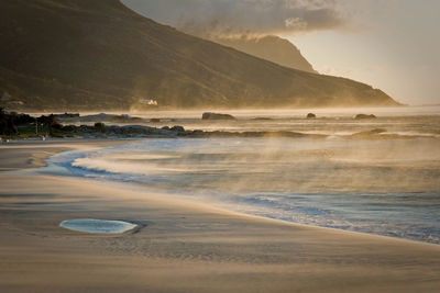 Scenic view of beach against sky