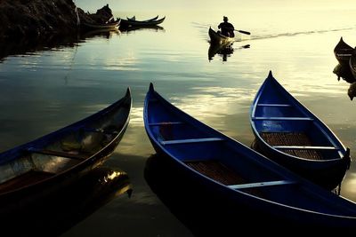 View of boat in lake against sky