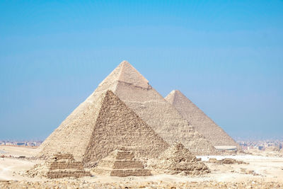 Low angle view of historical building against blue sky