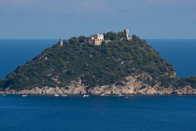 Scenic view of sea and buildings against sky