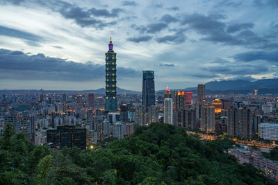 View of buildings against cloudy sky