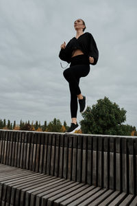 Low angle view of woman walking on staircase