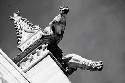 Low angle view of statue against sky