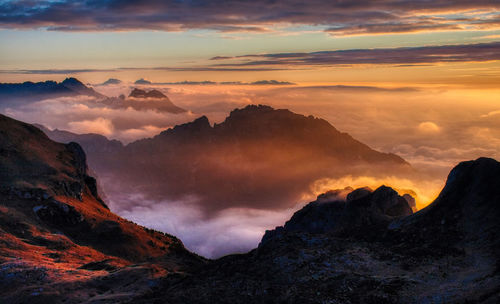 Scenic view of mountains against sky during sunset