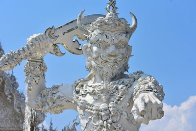 Sculpture at white temple in chiang rai, thailand