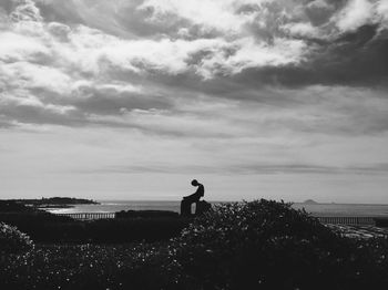 Scenic view of sea against cloudy sky