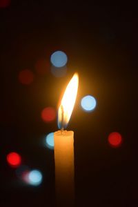 Close-up of illuminated candle