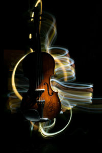 Close-up of electric lamp against black background