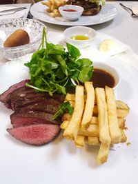 Close-up of food served on table