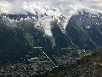 Aerial view of snowcapped mountains against sky