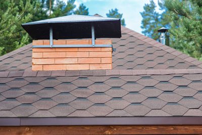 Close-up of roof tiles against building