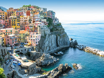 Residential buildings on cliff by sea