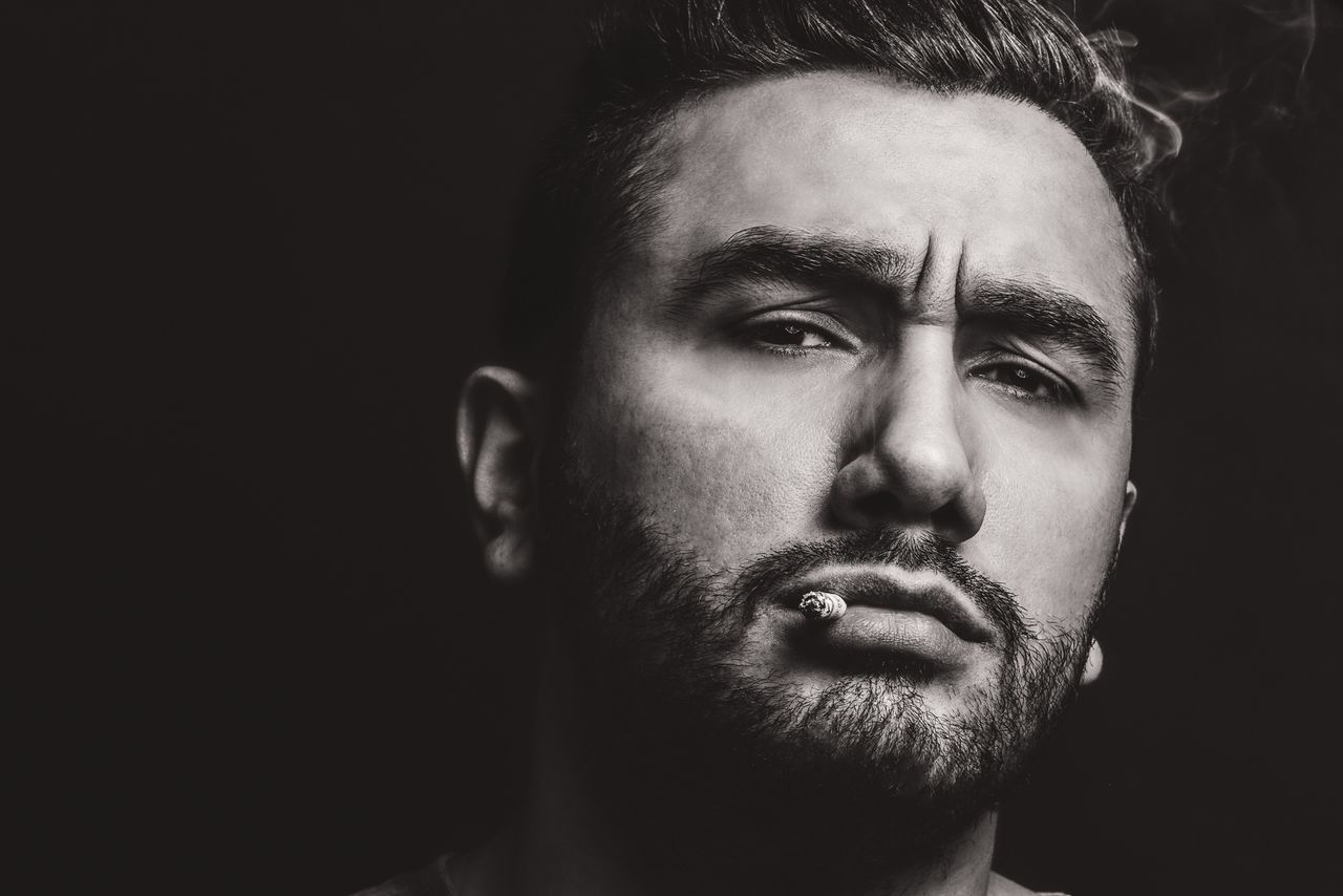 headshot, portrait, studio shot, looking at camera, person, young men, young adult, black background, close-up, front view, human face, lifestyles, mid adult, serious, mid adult men, indoors, beard, head and shoulders