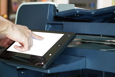 Midsection of man using smart phone