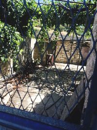 Fence seen through chainlink fence