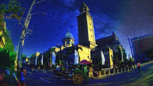 Panoramic view of illuminated buildings in city at night