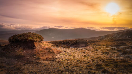 Scenic view of landscape against sky during sunset