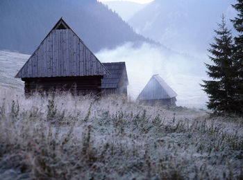 House on landscape against sky