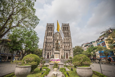 Panoramic view of temple amidst buildings against sky