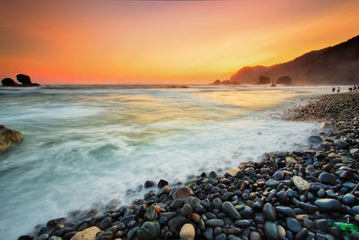 Scenic view of sea against sky during sunset