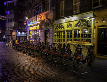 Bicycles on illuminated city at night