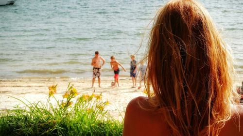 Rear view of woman on beach