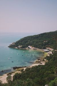 Scenic view of bay against clear sky