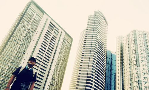 Woman standing in front of building
