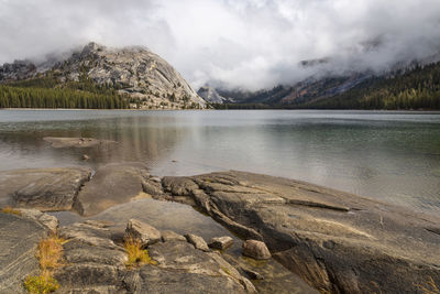 Scenic view of lake and mountains against sky