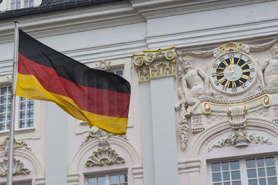 Low angle view of flag against building