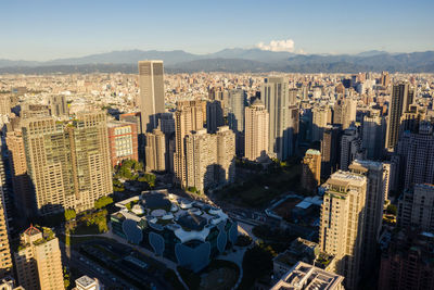 High angle view of buildings in city against sky