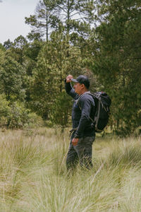 Rear view of man standing on field