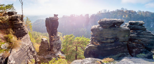 Rocky formation at bastei bridge in saxon switzerland on sunny autumn day with trees and leaves