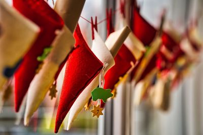 Close-up of multi colored decoration hanging in row