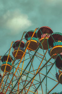 Low angle view of ferris wheel against sky