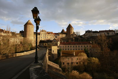 Old towers across the bridge against the sky