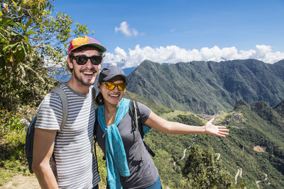 Couple posing for camera on the inca trail close to machu picchu