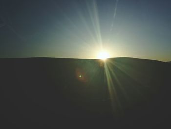 Sun shining through clouds