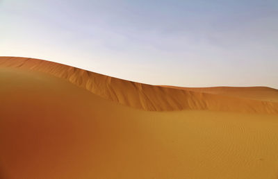 Scenic view of desert against clear sky