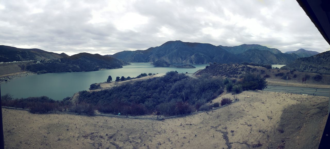 mountain, sky, mountain range, tranquil scene, tranquility, water, scenics, cloud - sky, beauty in nature, lake, nature, cloud, landscape, cloudy, non-urban scene, idyllic, day, river, reflection, remote