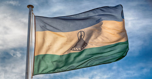 Low angle view of flag against the sky