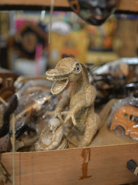 Close-up of figurines for sale at store