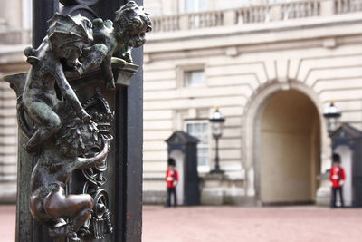 Close-up of statue against building